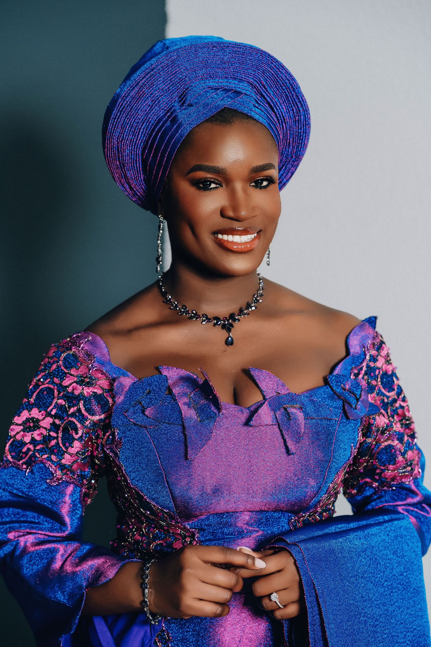 A series of portraits showing a woman in a vibrant blue and purple traditional African dress and headwrap.