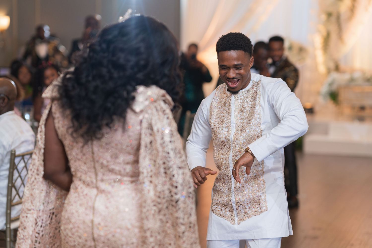 Wedding reception celebration with guests dancing and enjoying festivities.