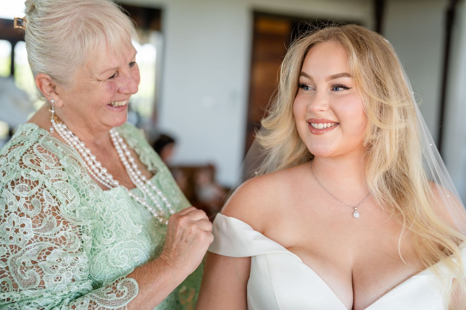 Wedding preparation moments showing makeup application and styling in natural light.