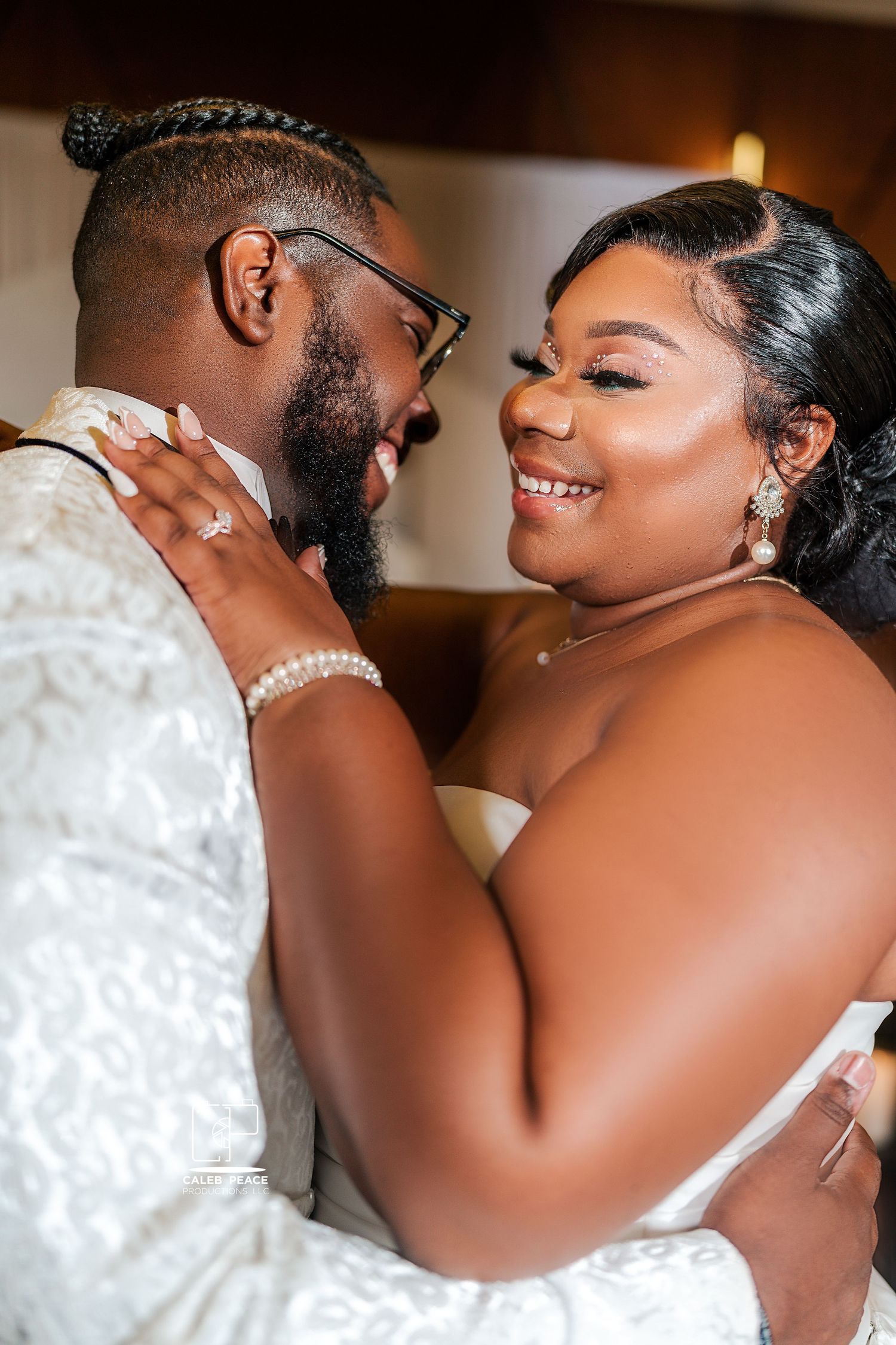 Intimate wedding dance sequence showing couple in white attire sharing romantic moments.