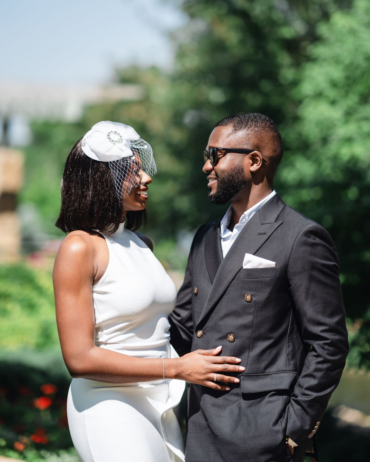 A series of romantic wedding photos showing a couple embracing outdoors in a lush green garden setting.