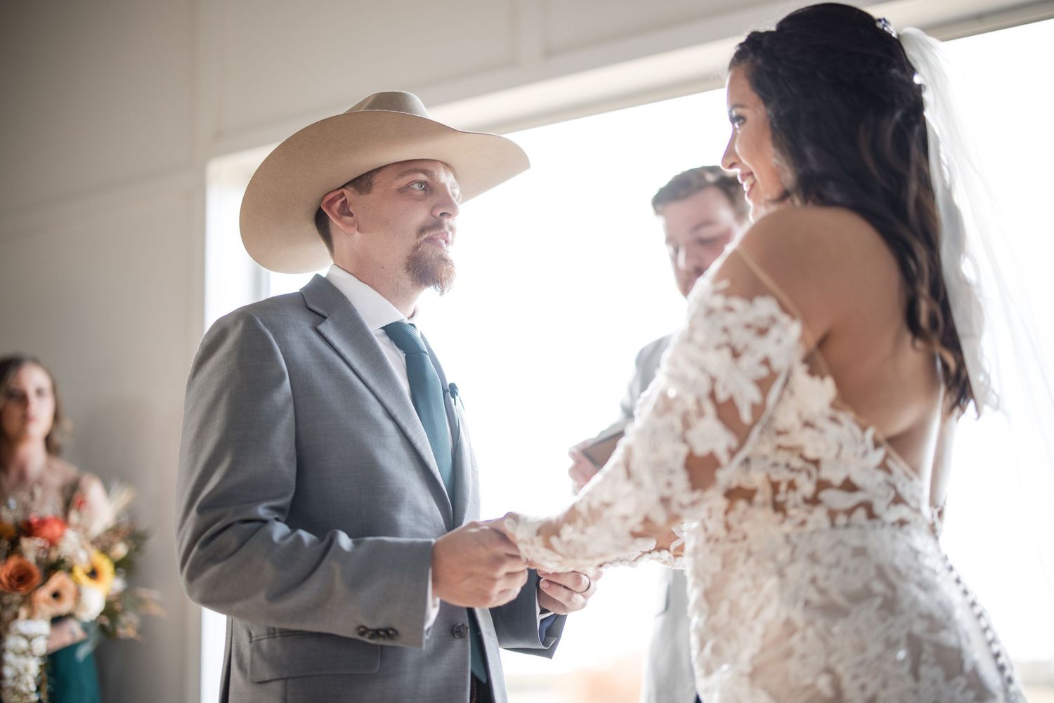 Wedding celebration candid moments inside a bright indoor venue with natural lighting.