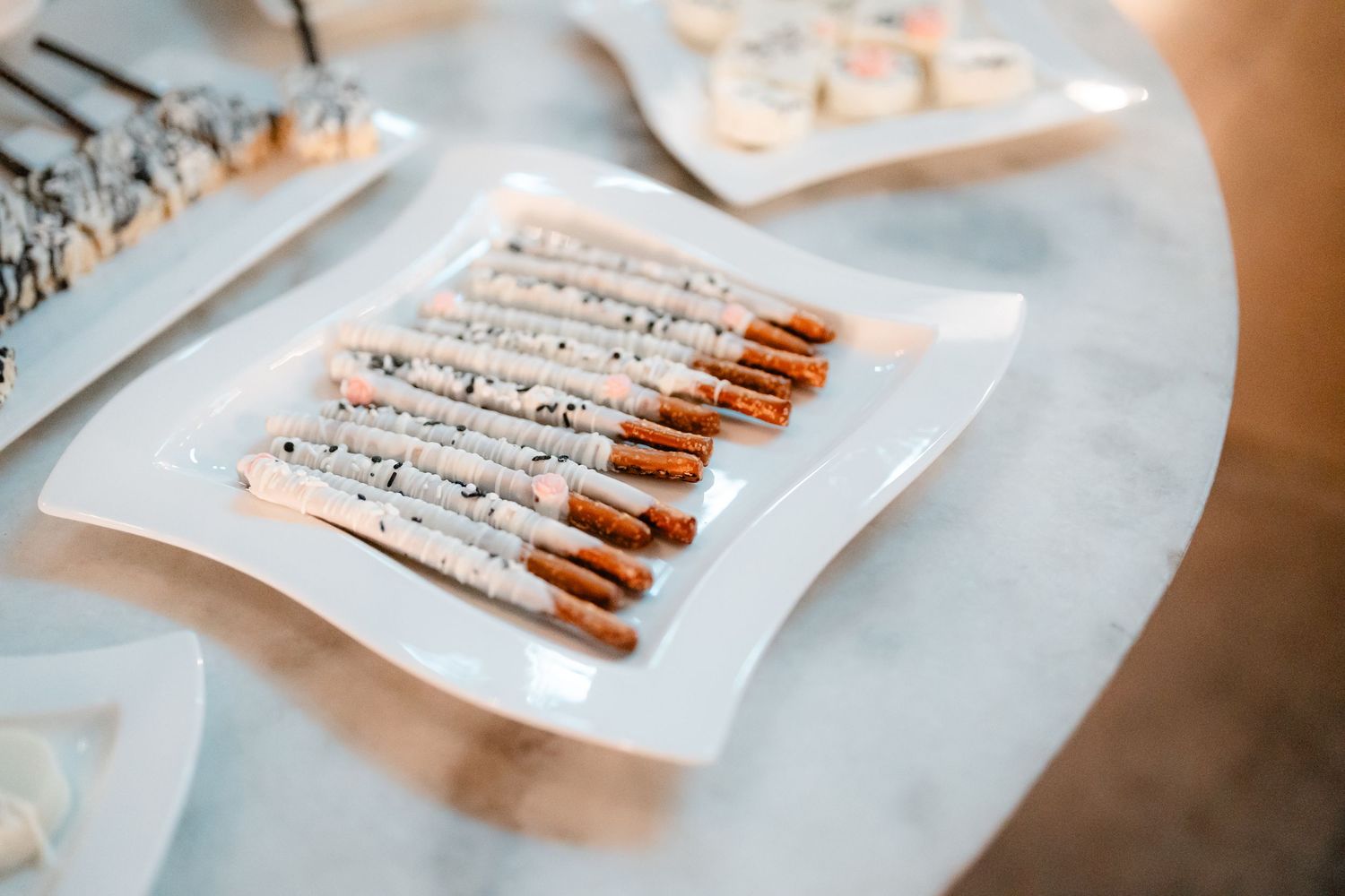 Wedding favor tags arranged neatly on light blue surface.