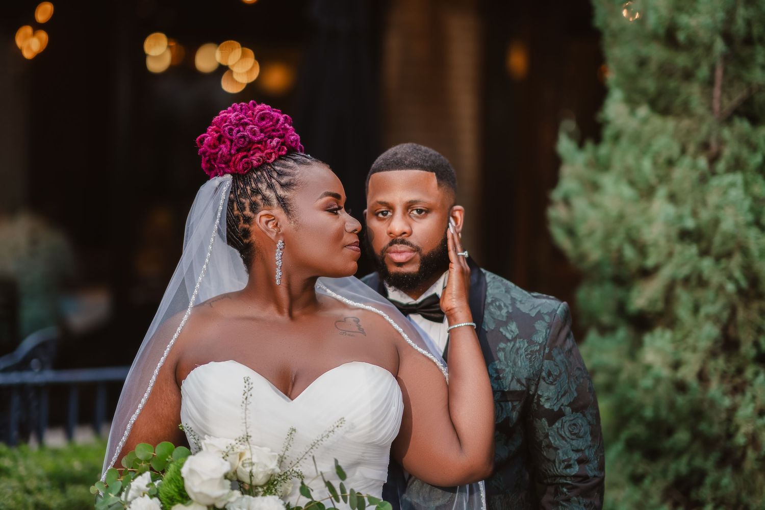 Romantic outdoor evening wedding portraits with bokeh lighting effects.