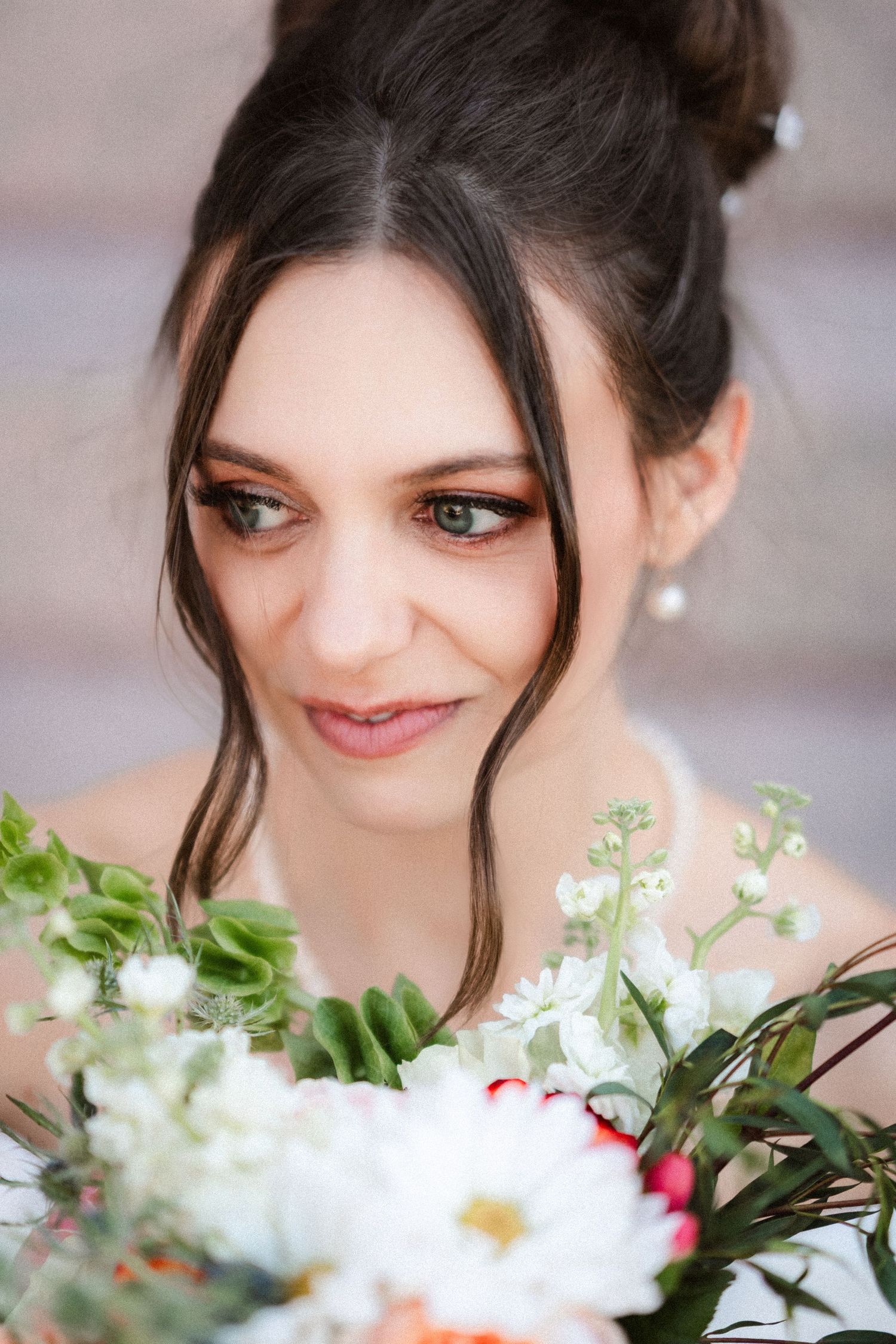 Close-up portrait with white flowers in the foreground.