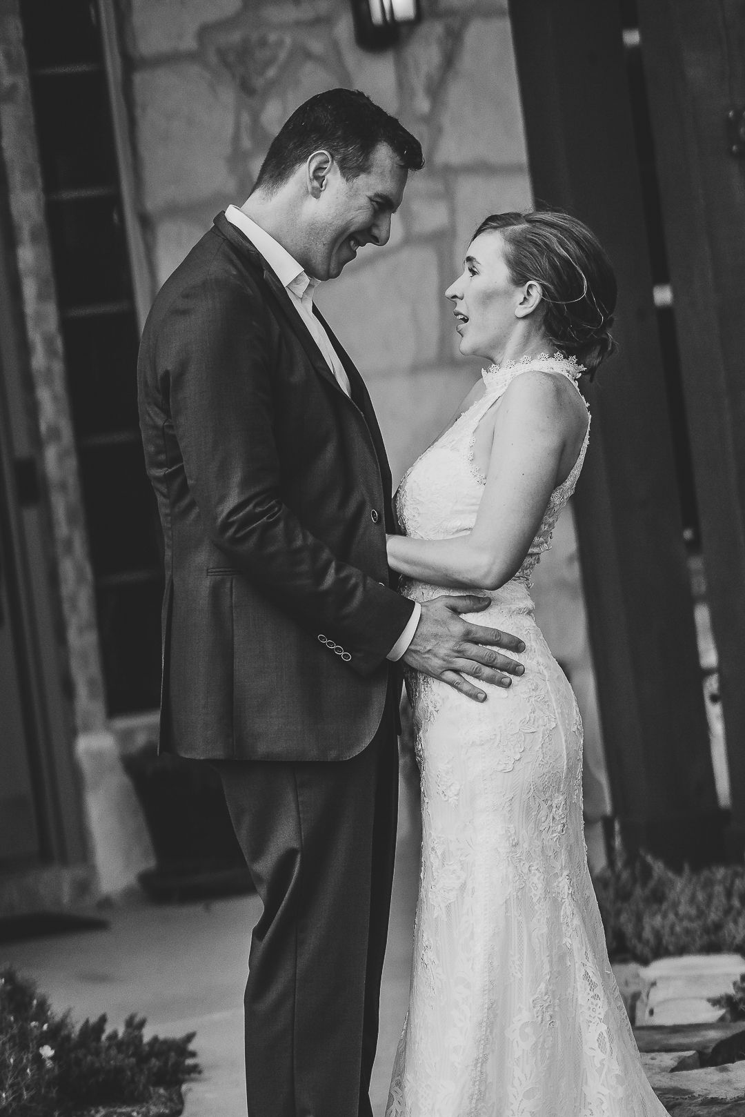 Black and white wedding photos capturing intimate moments between newlyweds.