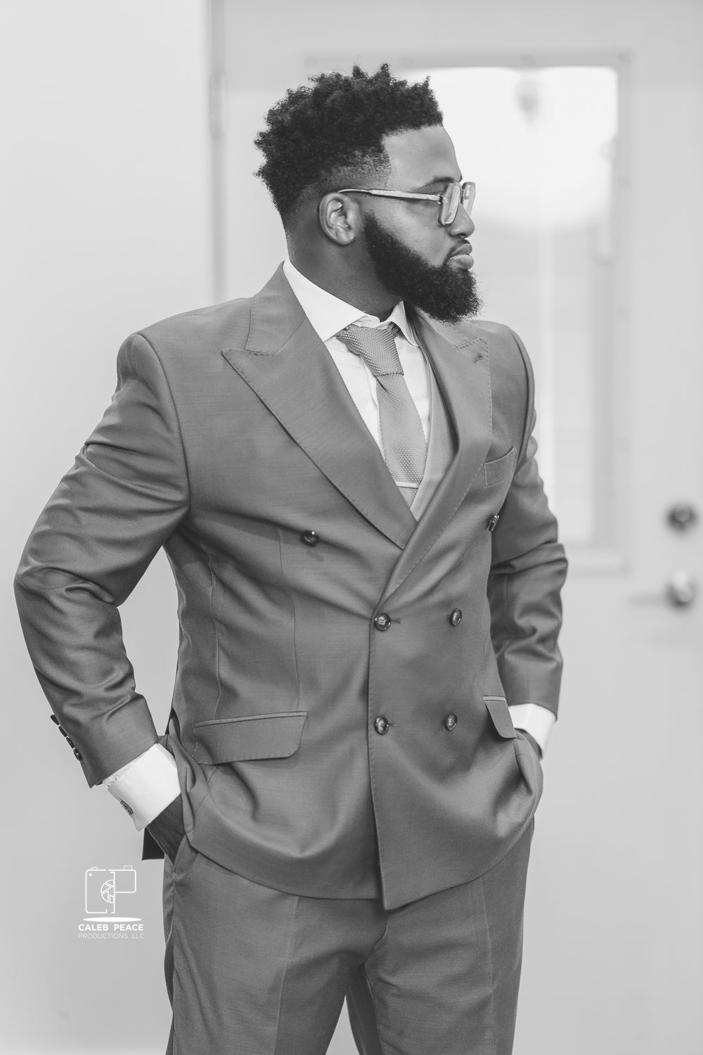 A series of black and white photos showing a groom in a stylish double-breasted gray suit.