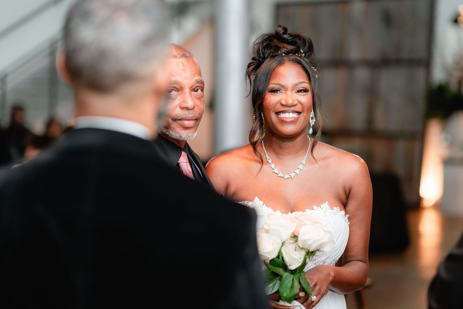 Candid wedding ceremony reactions showing joyful expressions and emotions.