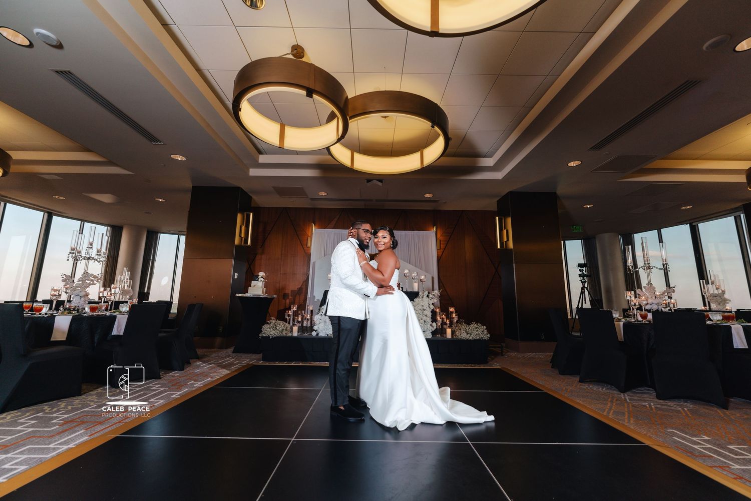 Elegant wedding reception venue with warm lighting and dark interior showing multiple angles of a dance floor setup.