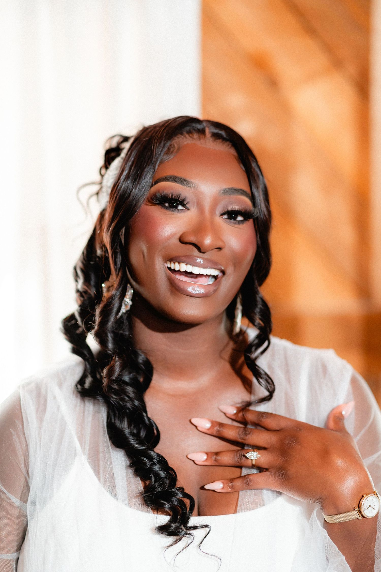 Bridal portrait series showing joyful expressions and elegant makeup.