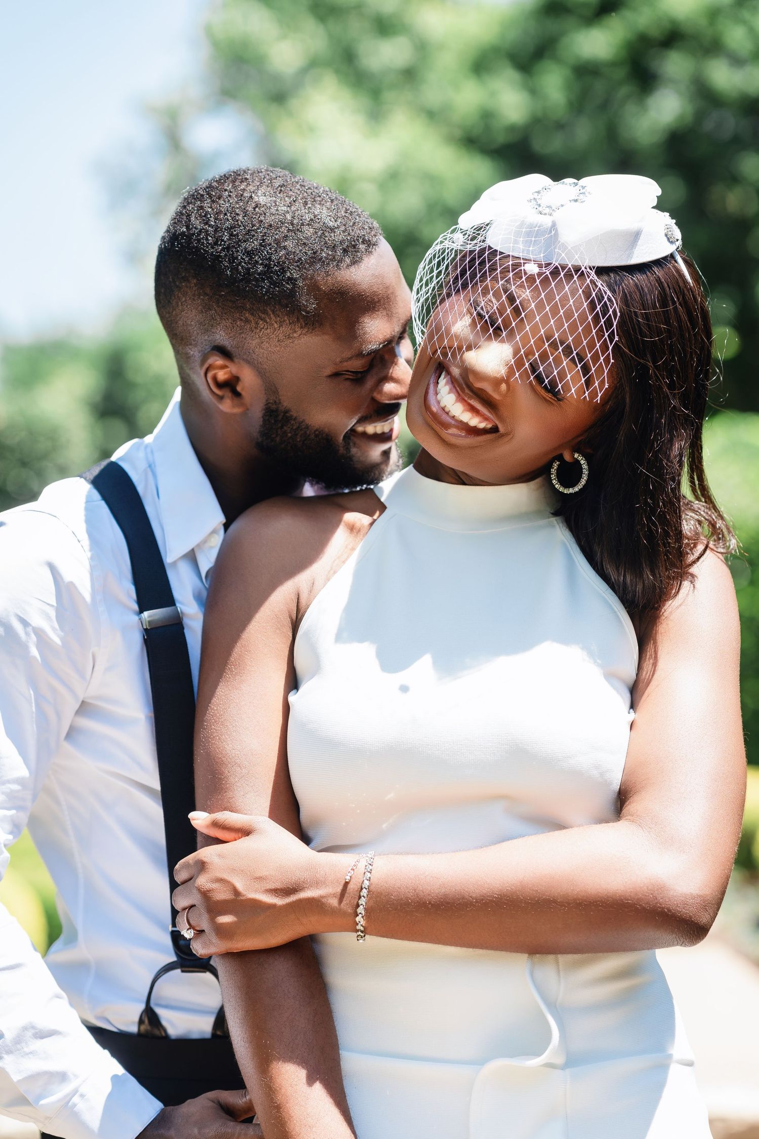 Romantic wedding photo sequence showing tender embraces and kisses in a sunny garden setting.