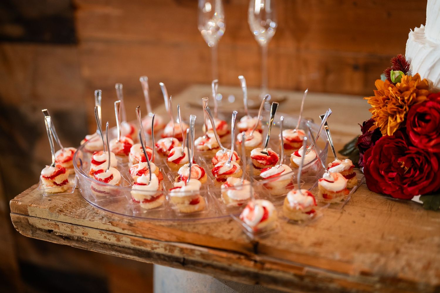 Wedding reception appetizers displayed on glass plates with elegant styling.