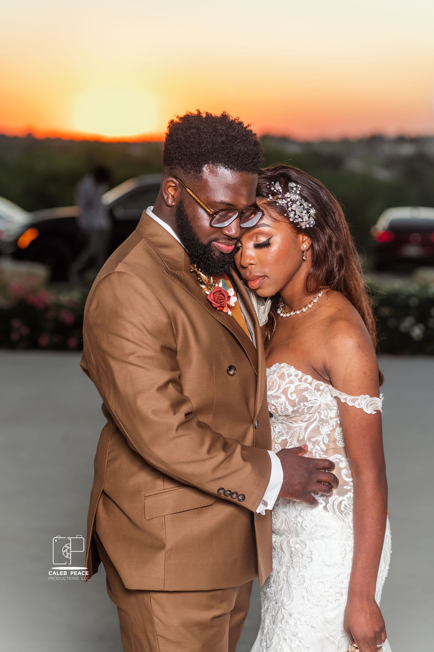 A romantic sunset wedding photoshoot with a couple in formal attire sharing intimate moments.