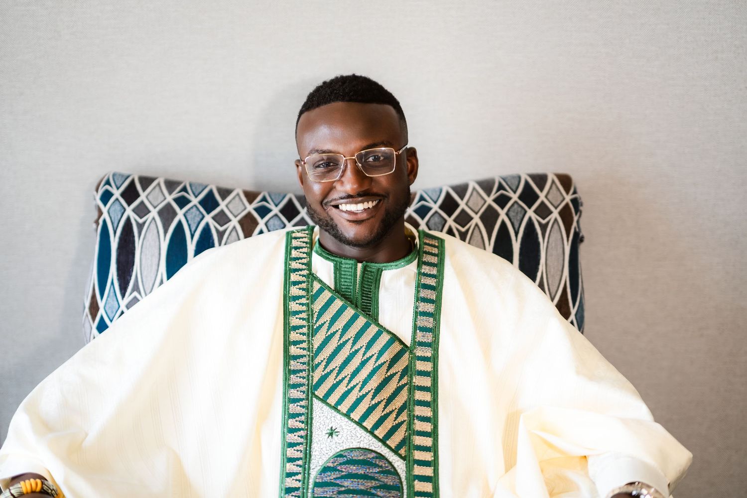 A green and white patterned shirt is displayed from multiple angles against a light background.