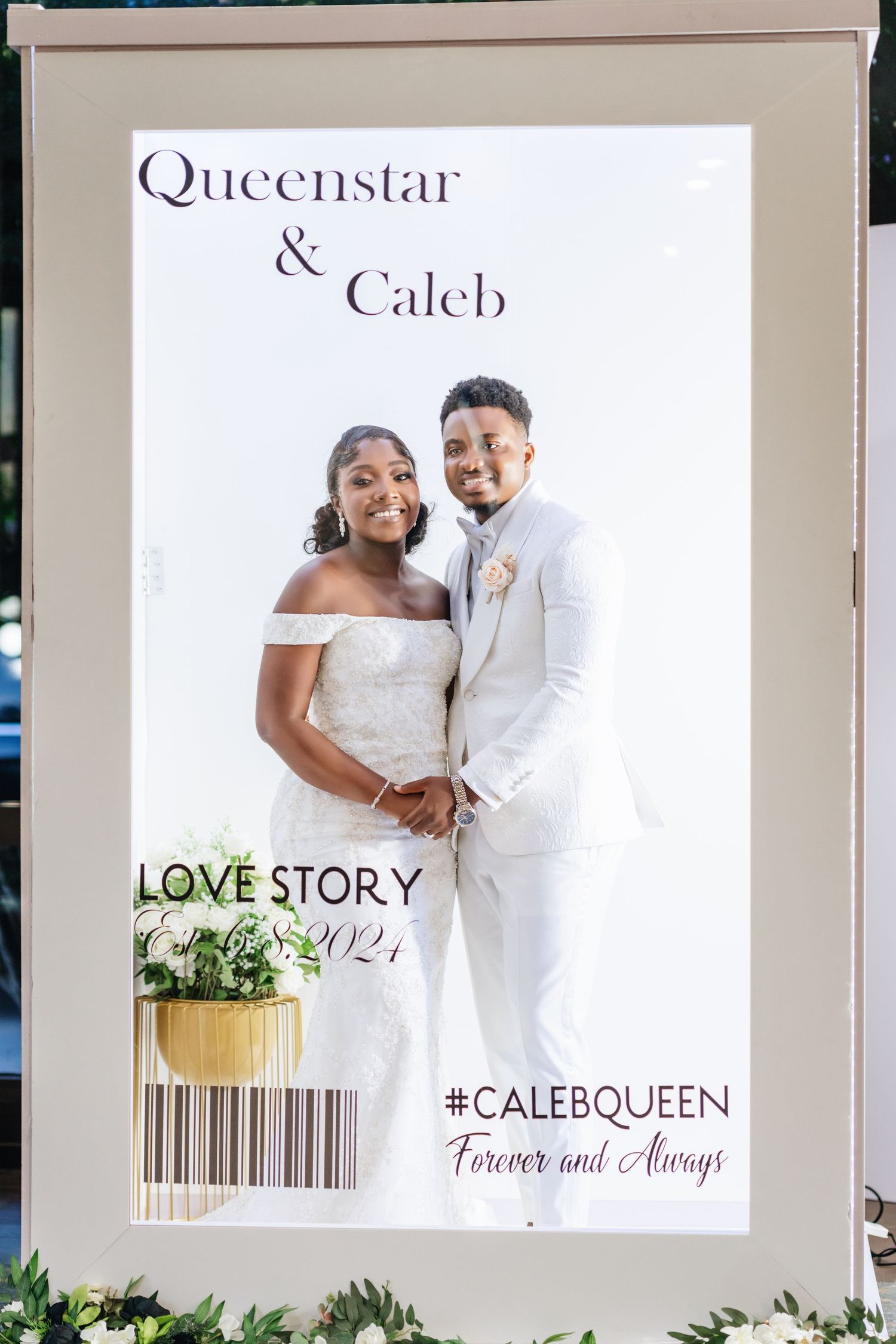 Modern wedding photo display with white and gold frames showing a love story theme.