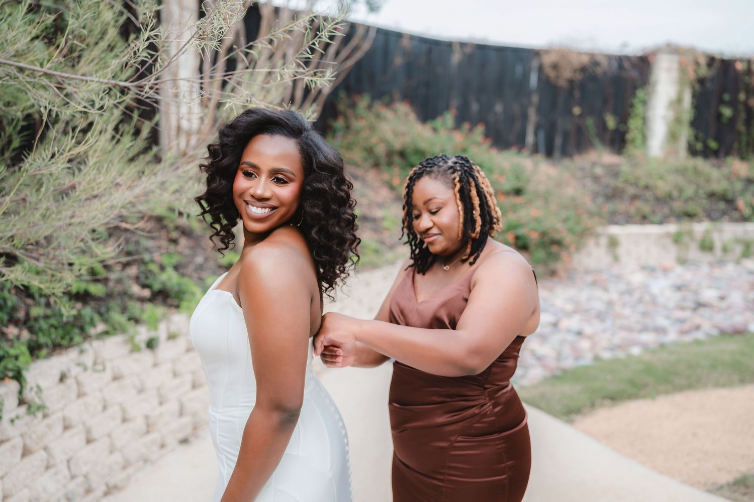 Candid wedding photos show tender moments between newlyweds in outdoor garden setting.