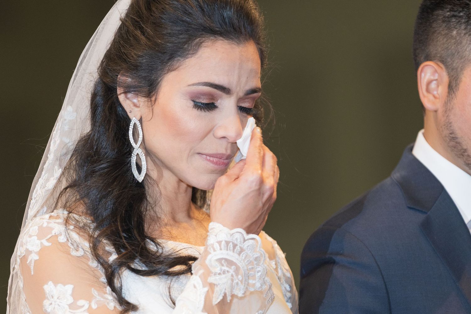 A bride and groom share intimate moments during their wedding photo session.