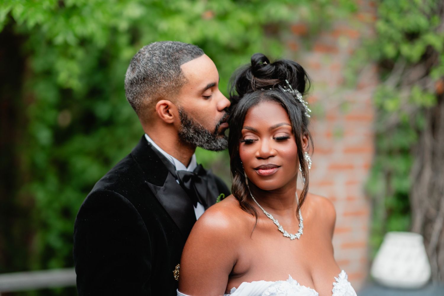 A romantic wedding photo collage showing tender moments between the couple in a garden setting with brick walls.