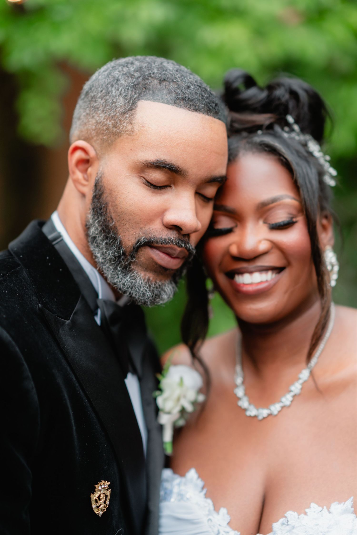 Romantic wedding portrait series showing tender moments between newlyweds in an outdoor garden setting.