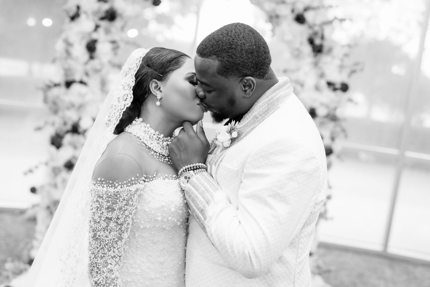 A romantic black and white wedding photo collage showing tender moments between a couple on their special day.
