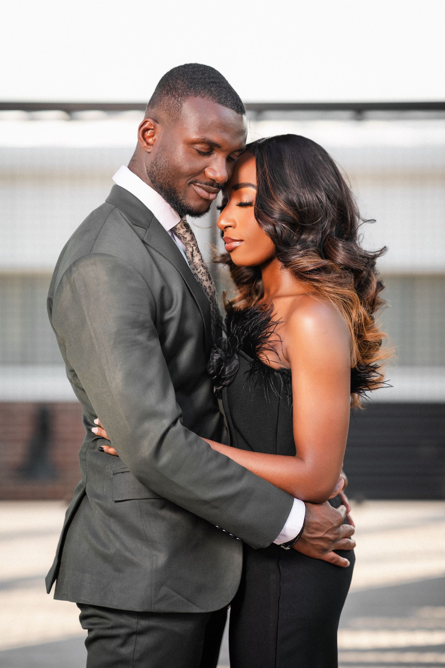 Romantic couple in formal attire sharing intimate moments in a series of outdoor photos.