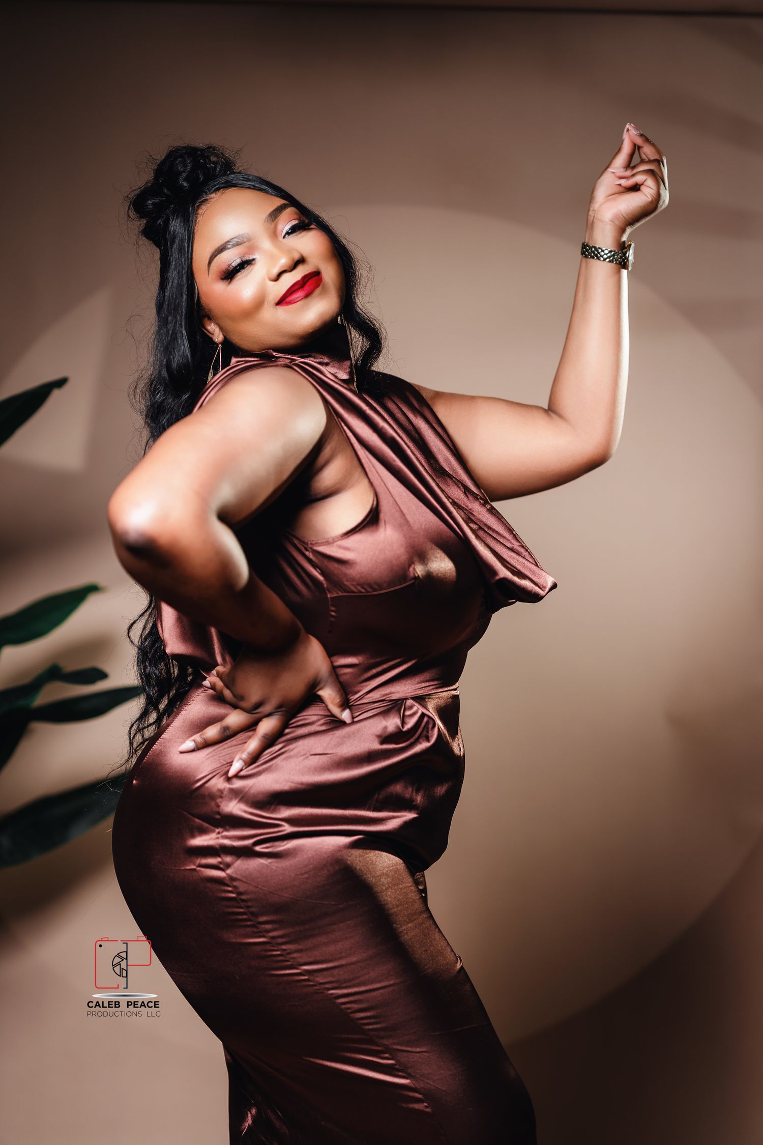 A fashion photo series showing a model in a shimmering brown satin dress posing against a neutral backdrop.