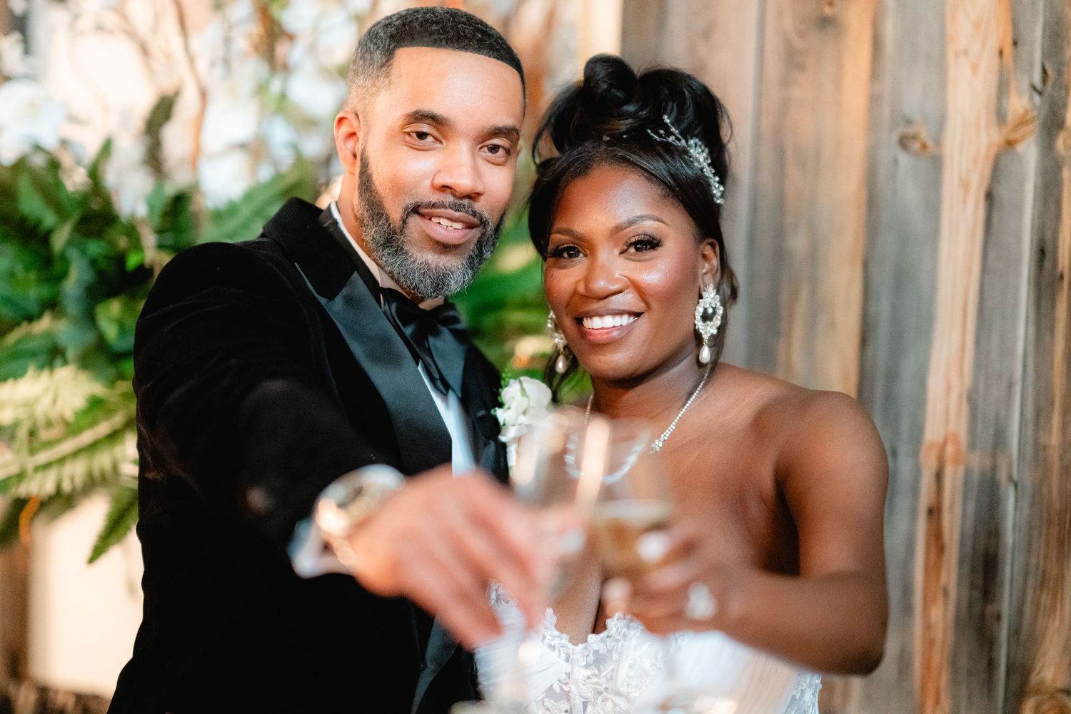 A happy couple sharing an intimate moment during their wedding day outdoors.
