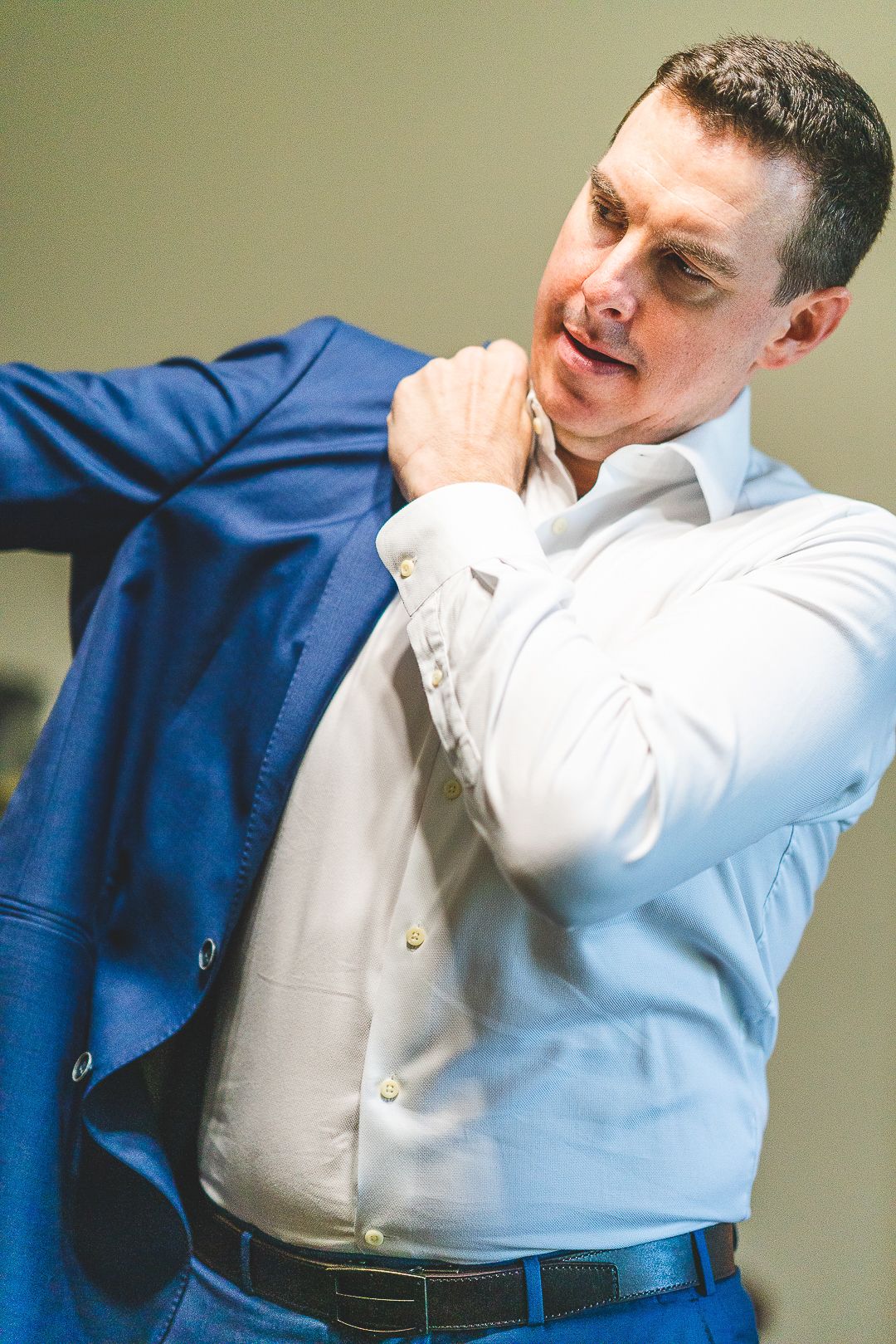 Emotional reactions during a wedding ceremony with blue and white attire.