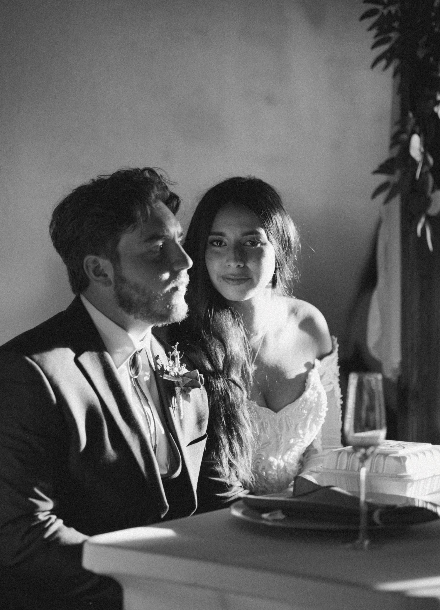Intimate black and white portrait of a couple sharing a romantic moment.