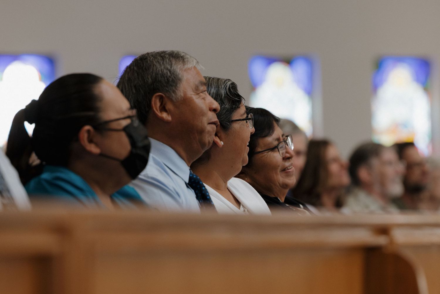 Church congregation seated in pews during a religious service.