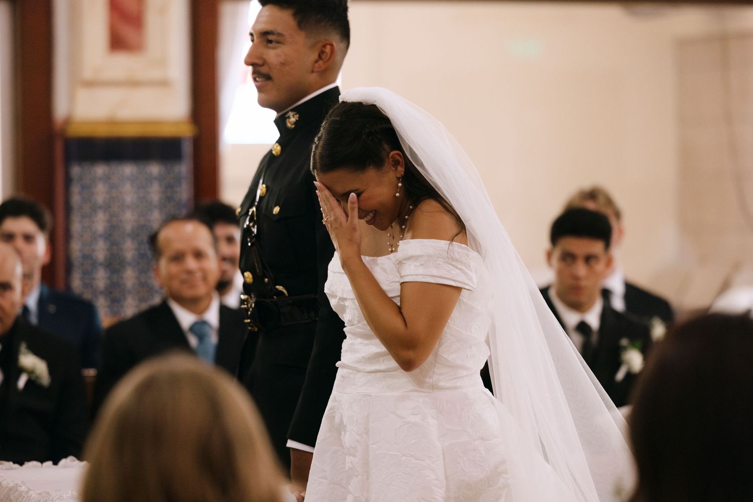 An emotional moment during a military wedding ceremony in a church.