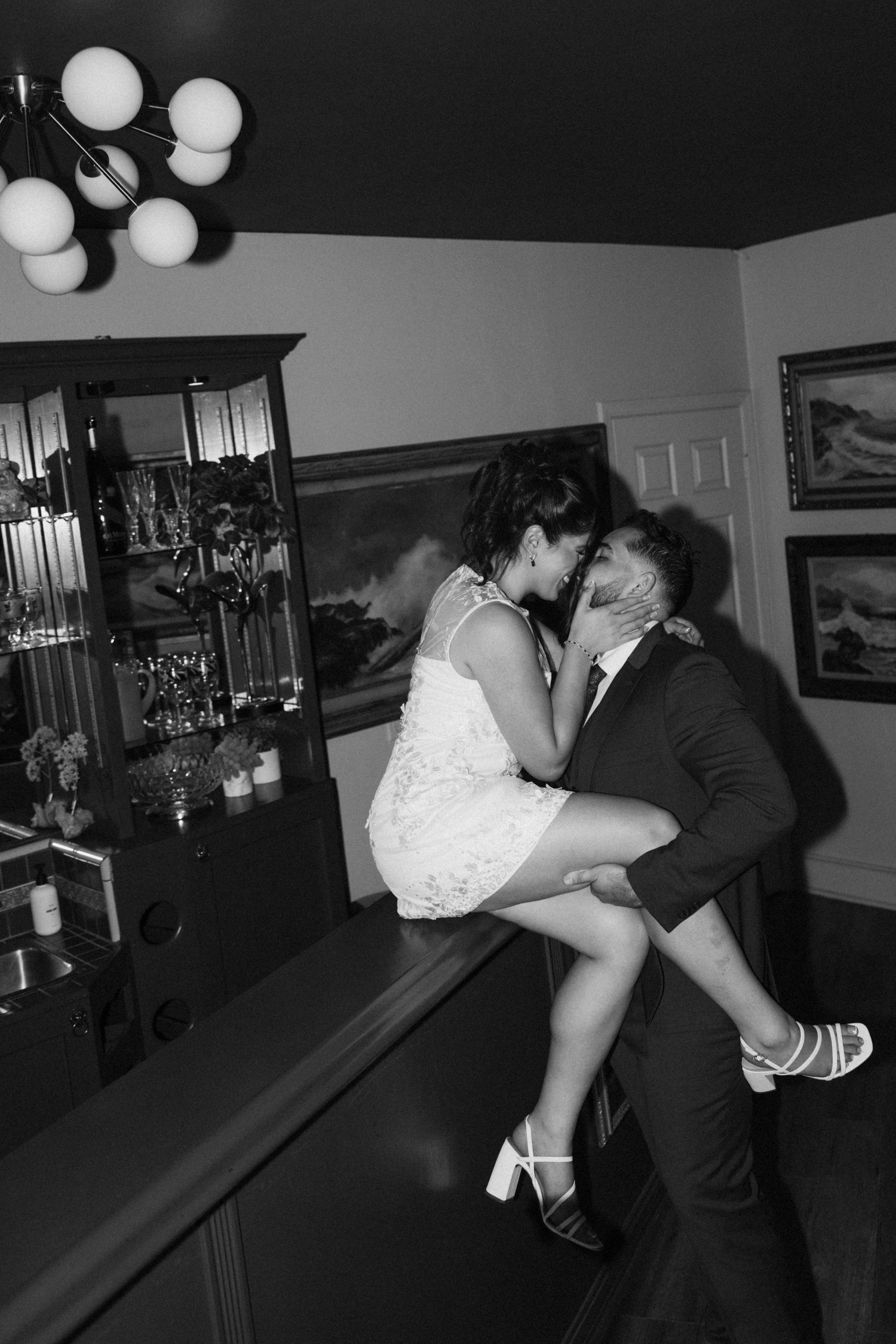 Black and white photos of couple dancing intimately in formal wear.