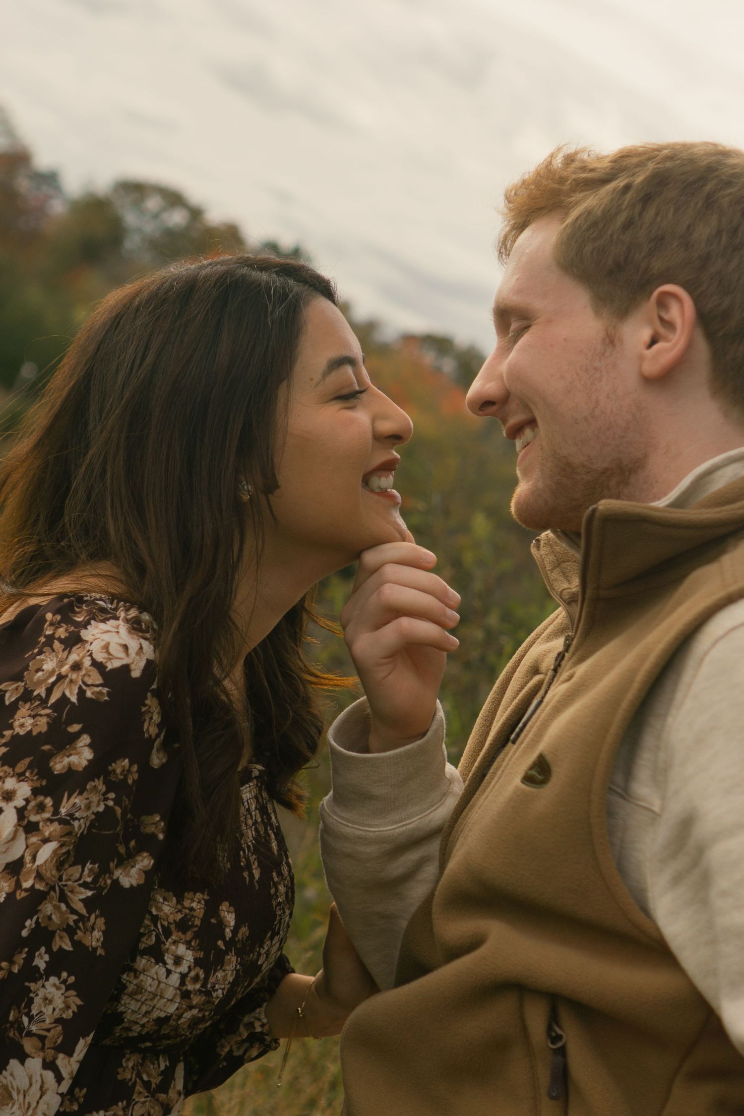 A couple shares intimate romantic moments outdoors in a series of candid photographs during autumn.