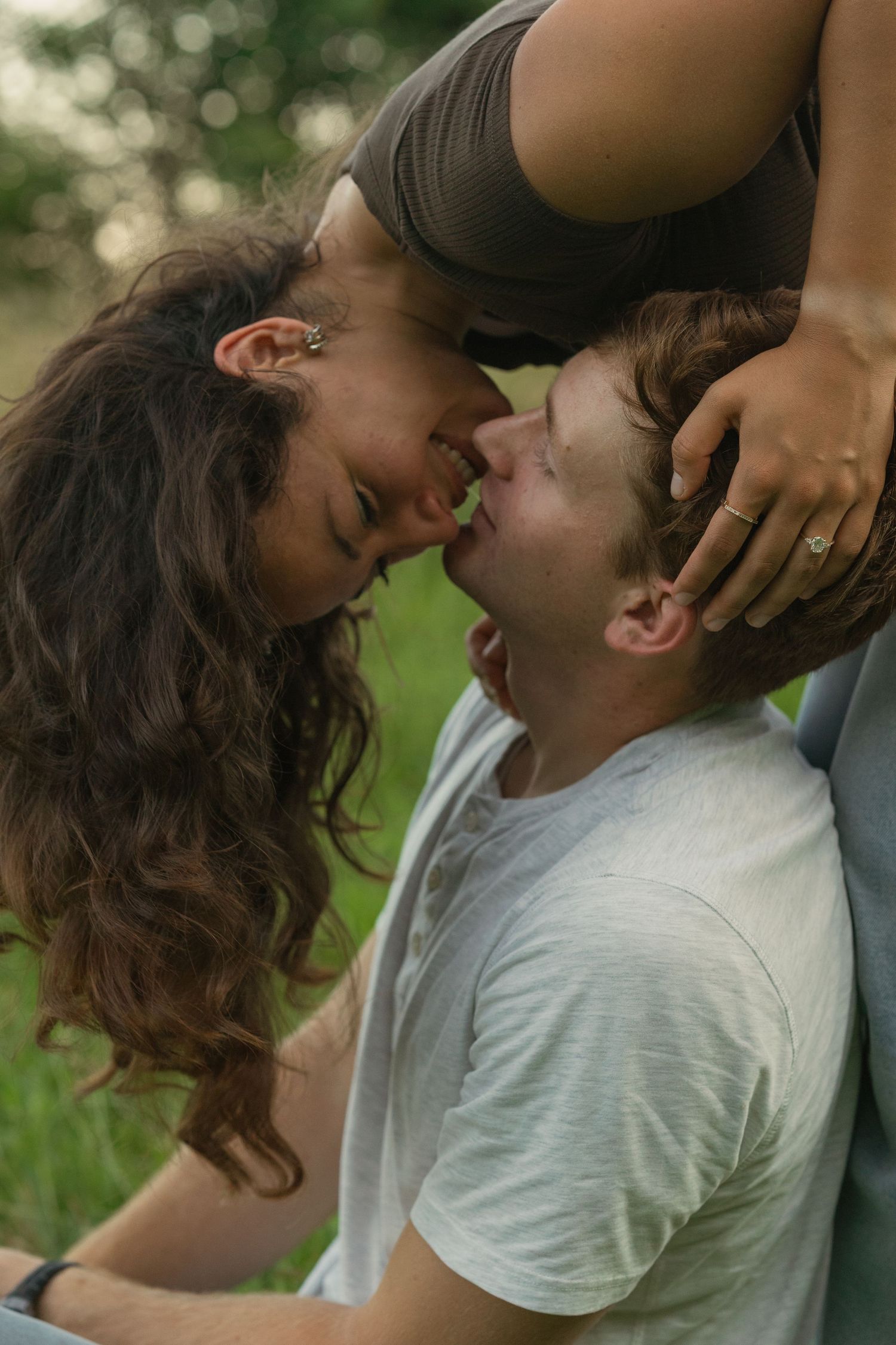 Newly engaged couple about to kiss