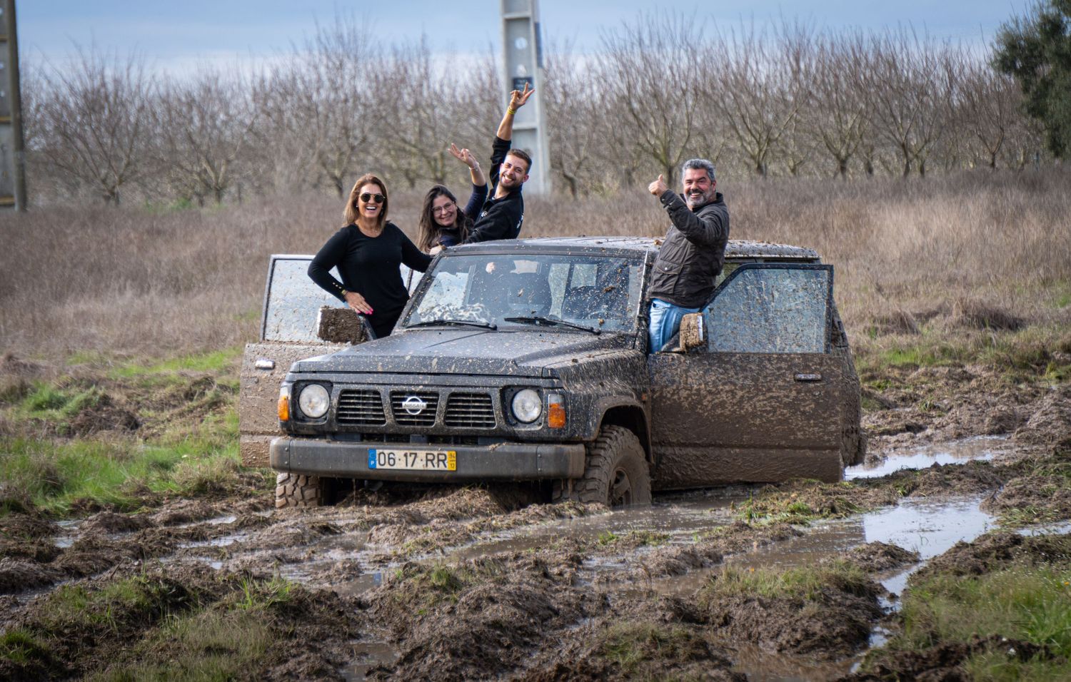 Off-road vehicles navigate through muddy terrain and water crossings during an adventurous trail expedition.