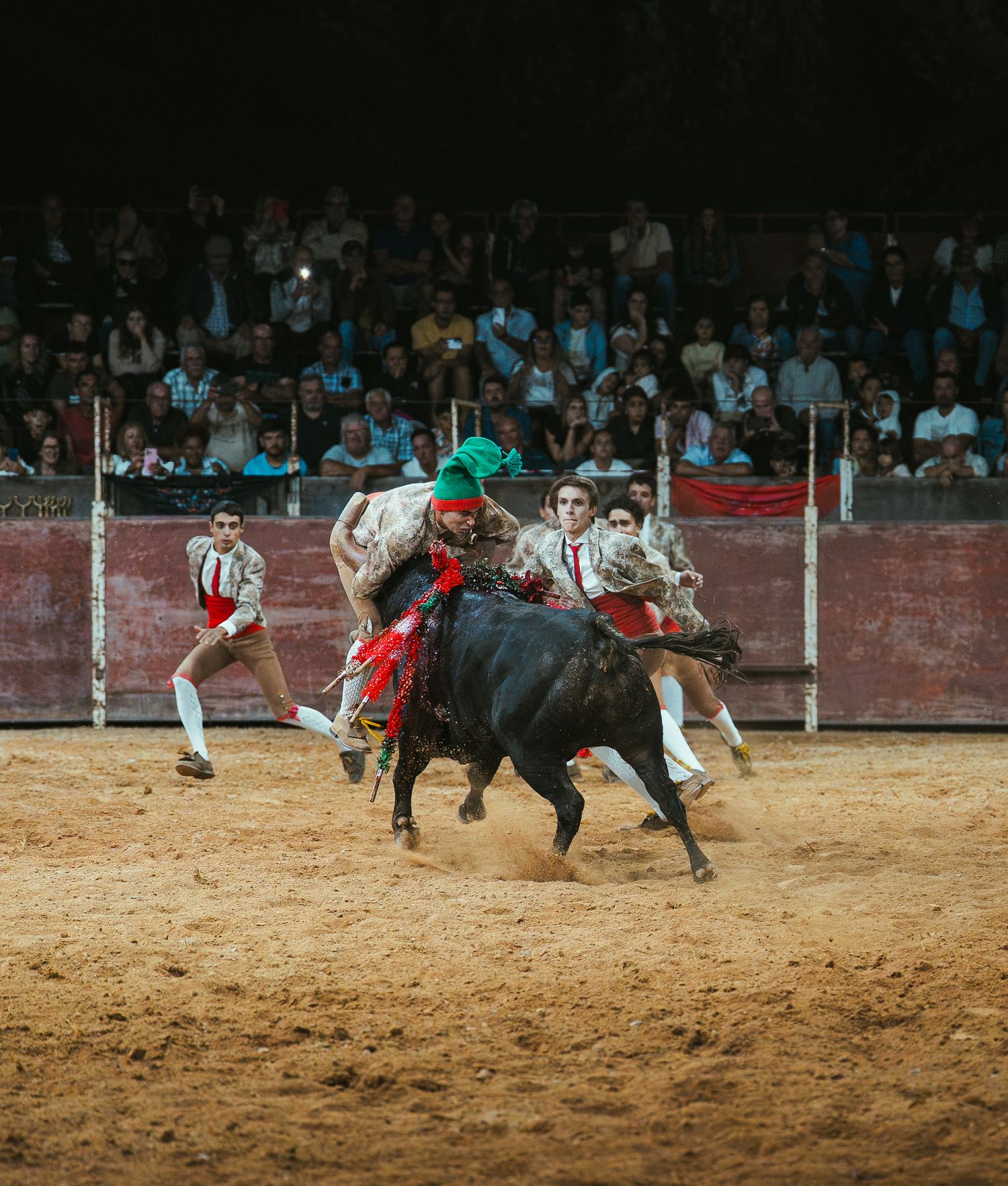Dramatic sequence of a bull rider being thrown from a bucking bull in a rodeo arena.
