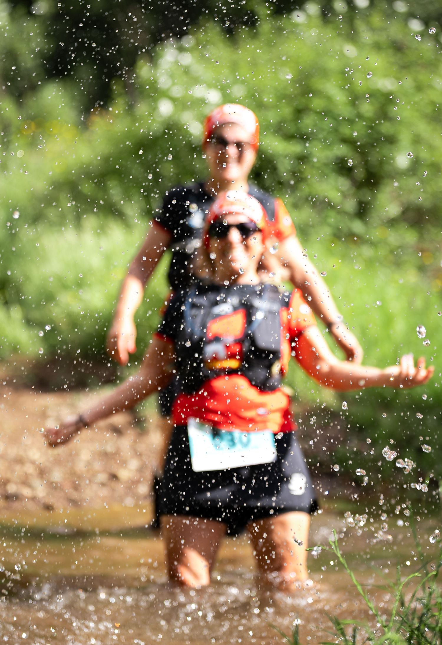 Motion shot of water splashing during an outdoor trail running event.