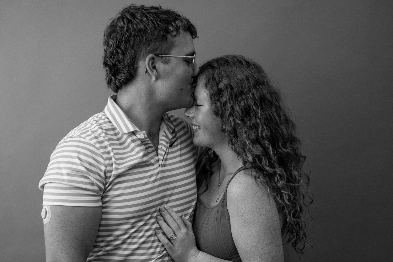 Intimate black and white series of a couple sharing romantic moments together.