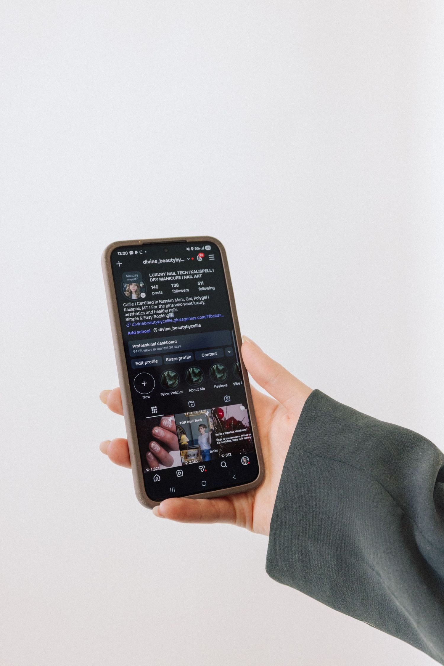 Hand holding smartphone displaying dark mode interface with circular icons and menu options in modern app design.