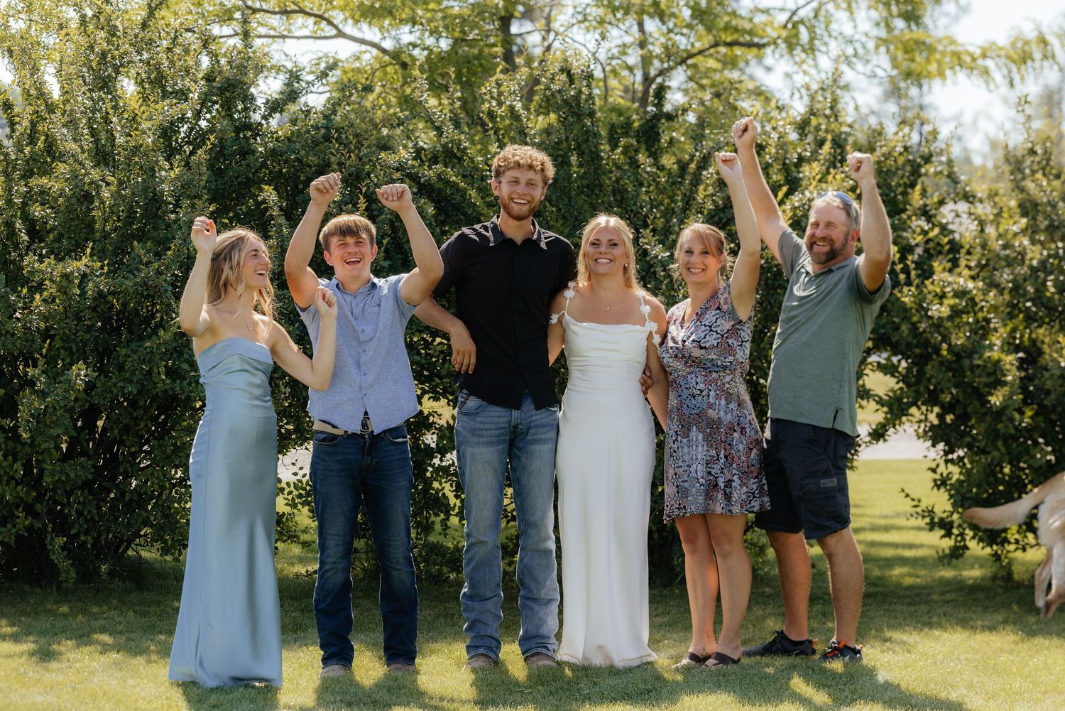 Group celebration photo sequence outdoors with people raising arms in joy.