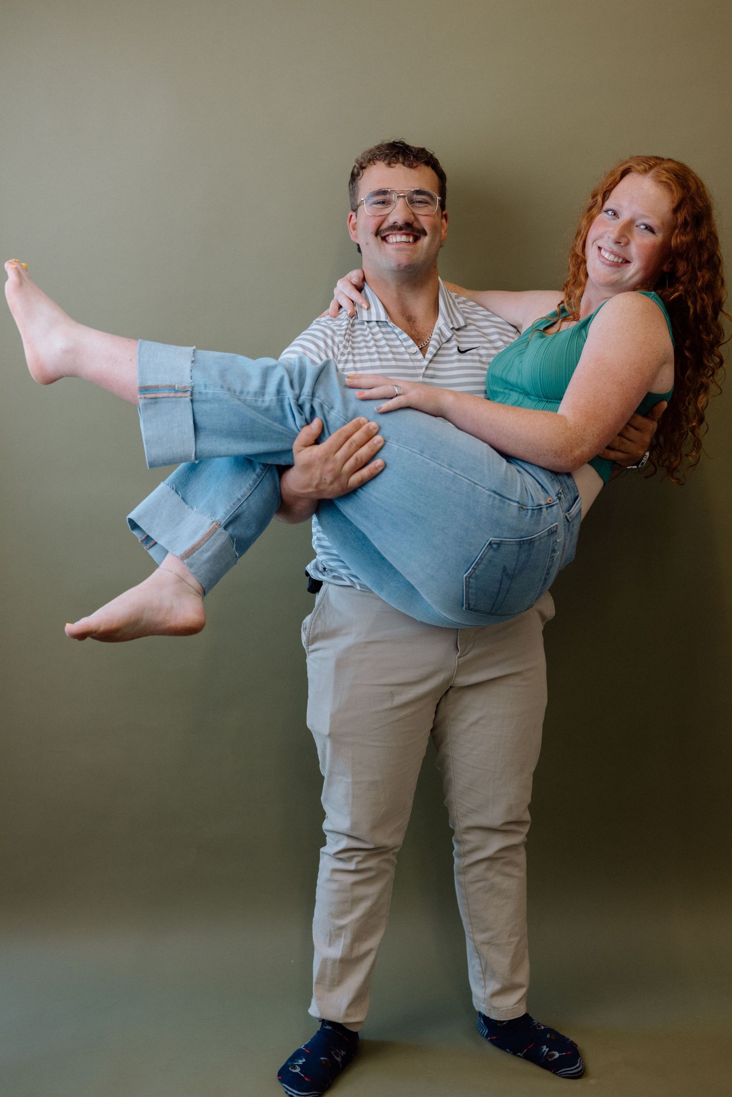 Playful sequence showing a couple dancing together with one person being dipped in light-hearted poses.