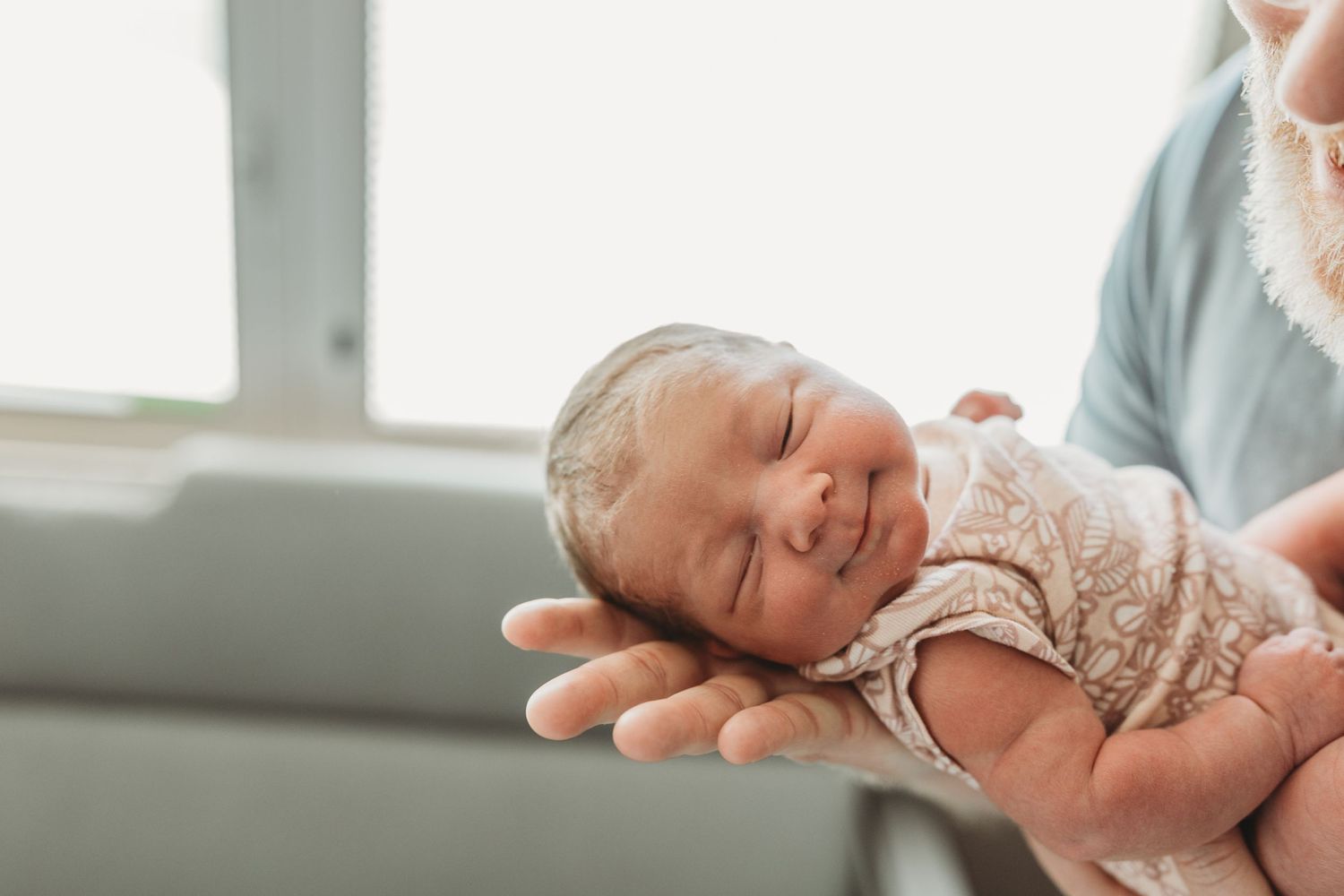 Newborn smiles at her Fresh 48 session in Tulsa, OK