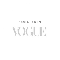 Elegant gray 'Featured in Vogue' text banner.