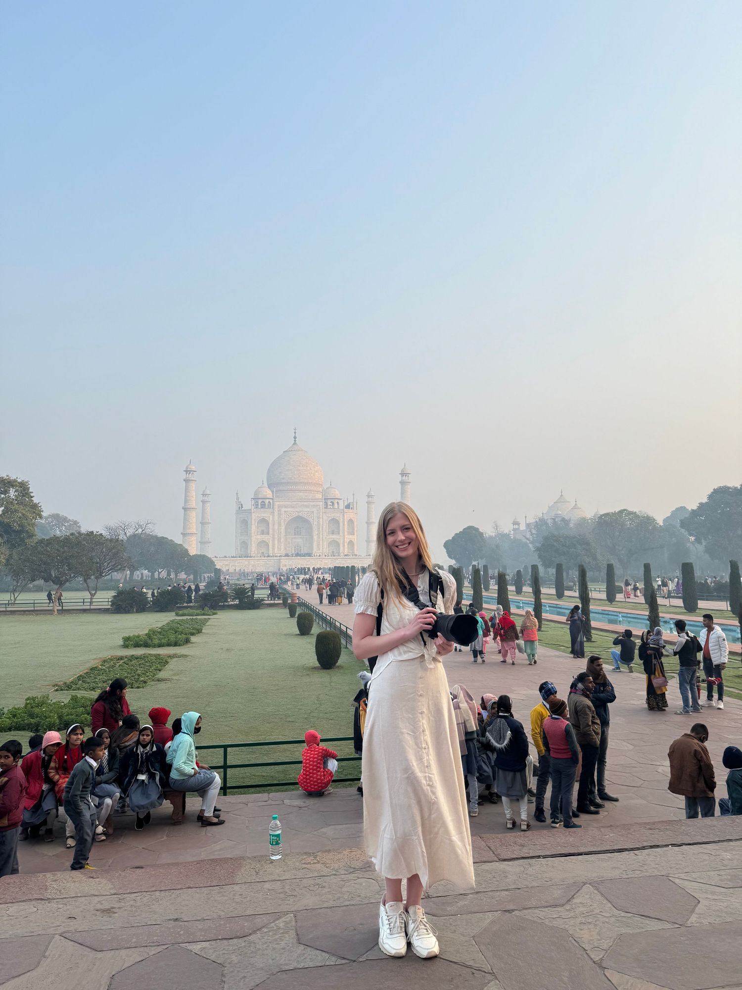 A series of photos showing visitors at the iconic Taj Mahal in Agra during a foggy morning with sparse crowds.
