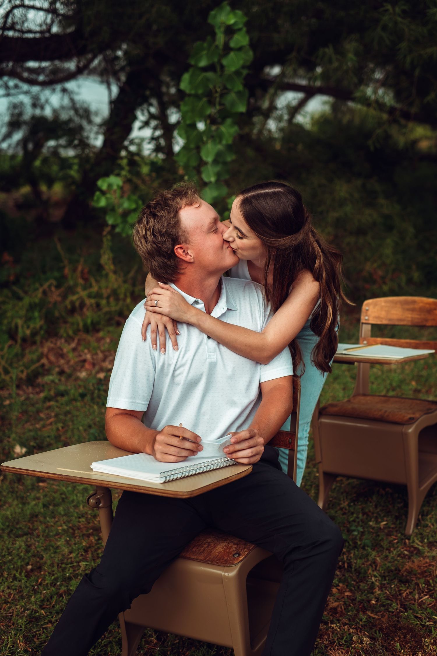 Romantic couple kissing during engagement in Dallas Nature
