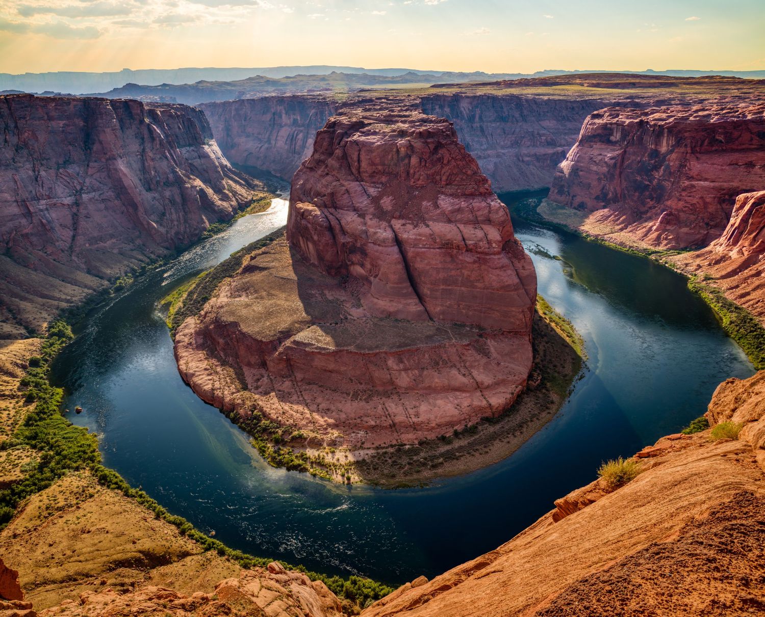 Scenic Horseshoe Bend overlook showing Colorado River curving through red sandstone canyon.