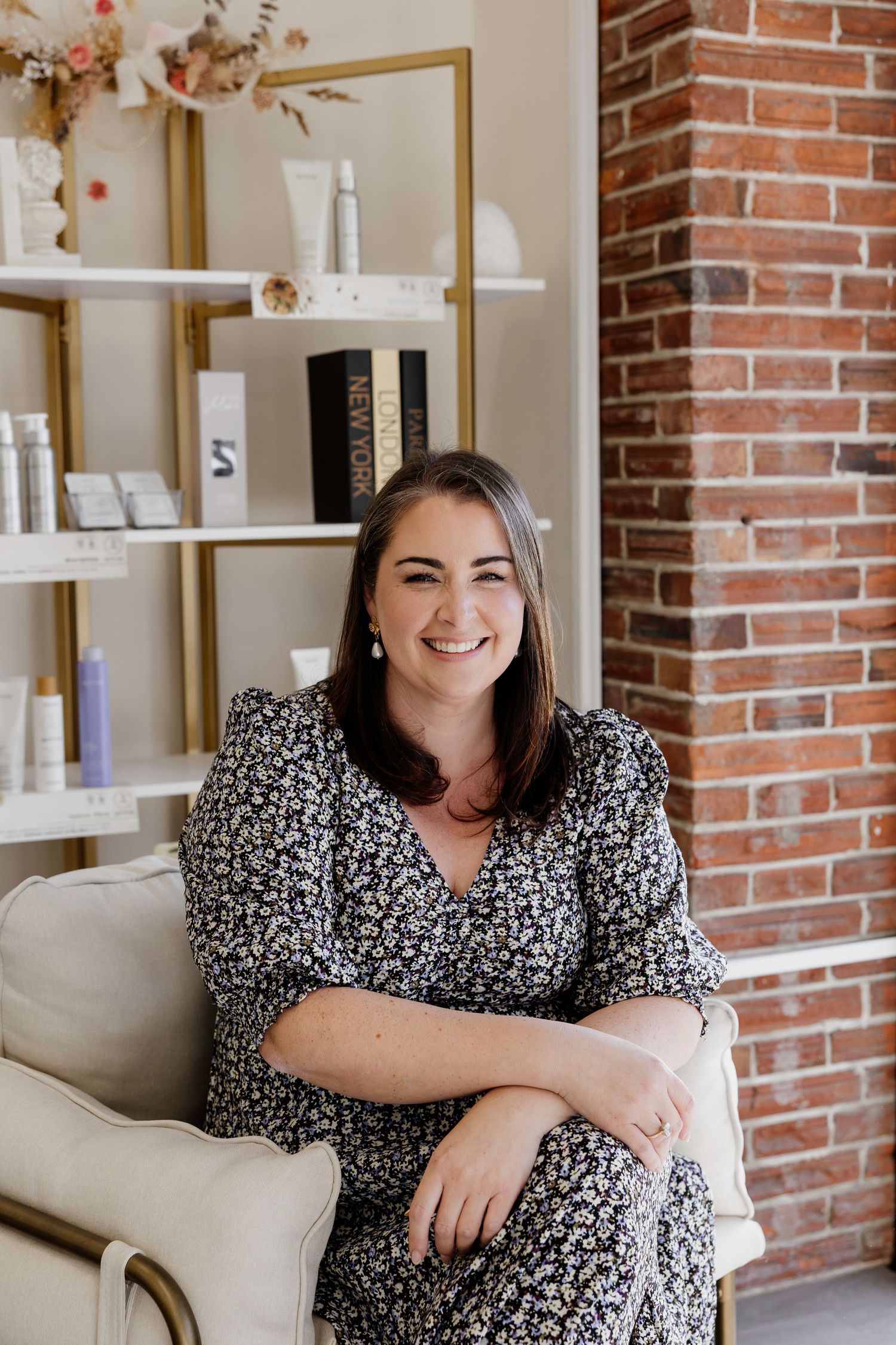 Business owner portrait in a stylish salon setting with exposed brick and product shelving — Oh Joy! Photography Tauranga
