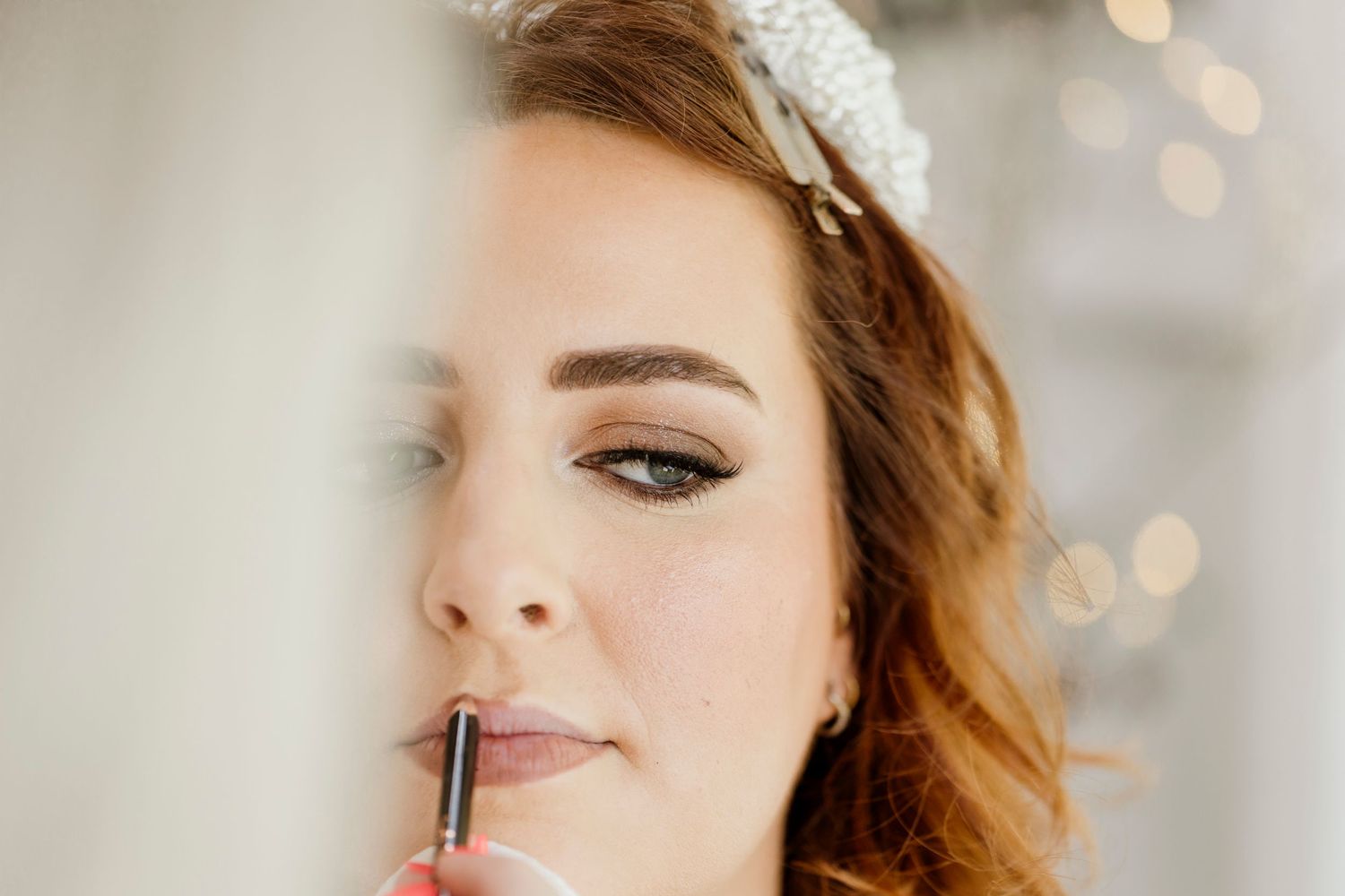 Bride having her makeup applied on her wedding morning — wedding photography by Oh Joy! Photography, Tauranga