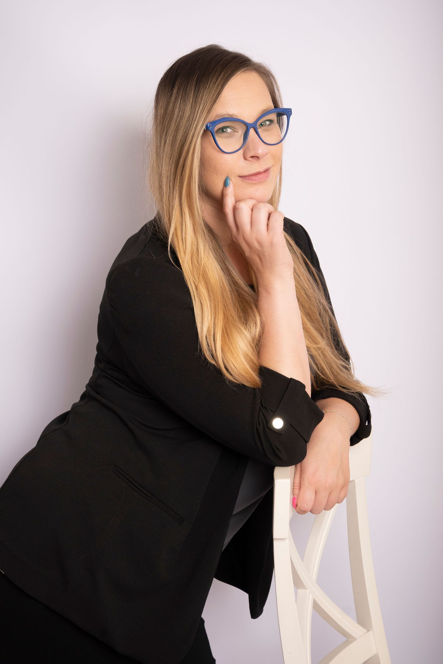 Woman leaning on a chair during a personal branding session by a Central Florida Photographer.