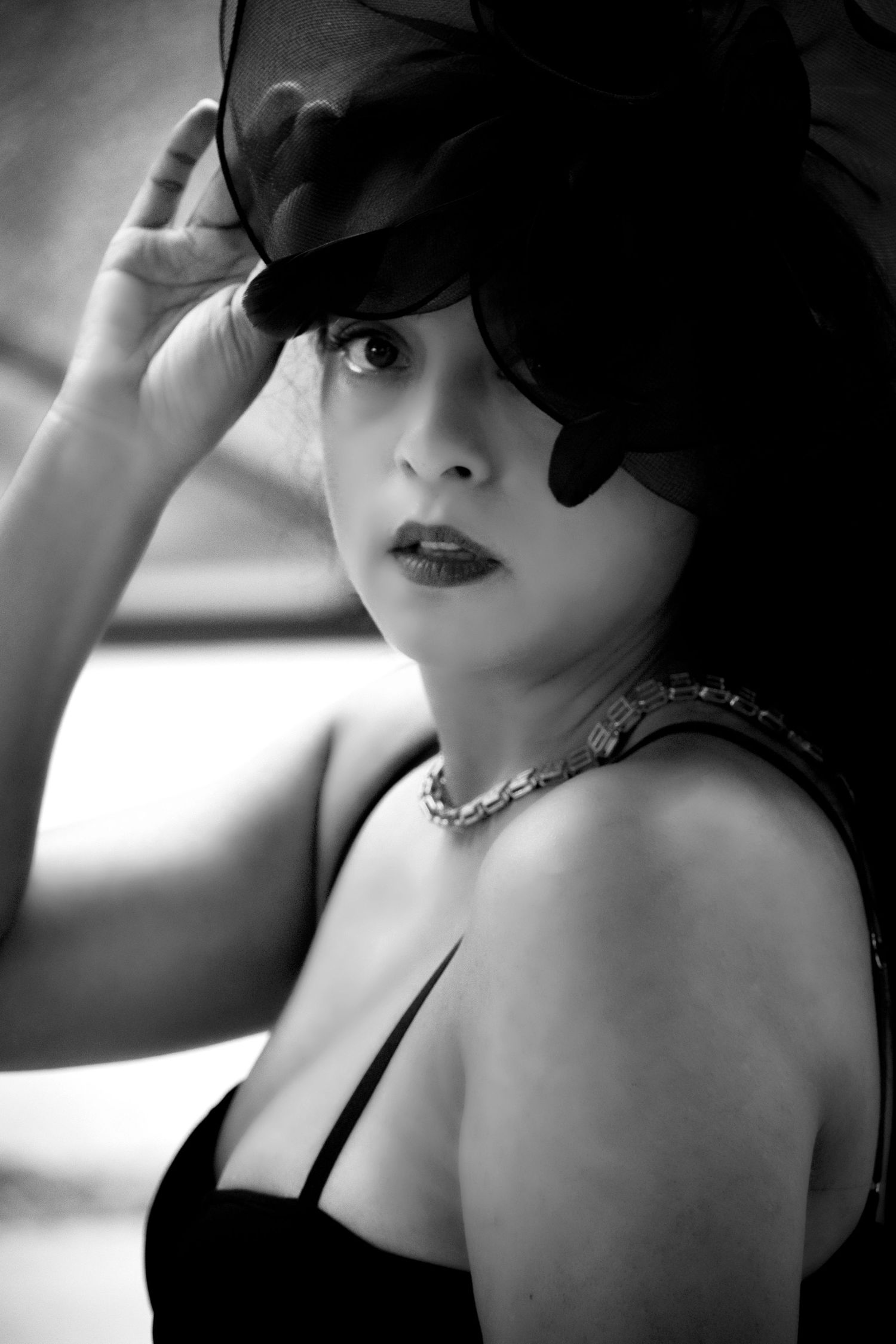 Black and white close-up portrait of a woman with dramatic lighting by a Central Florida Photographer